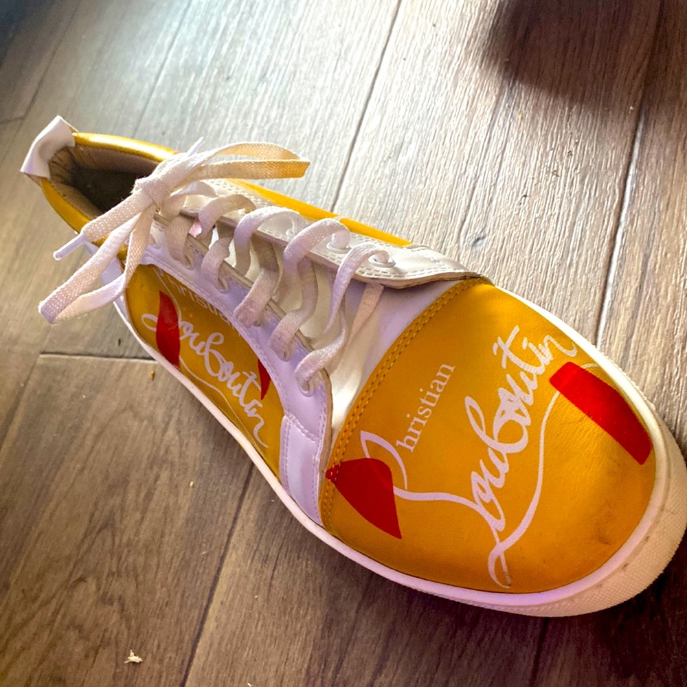 Red and Yellow Christian Louboutin Sneakers/ Red Bottoms. worn a couple of times